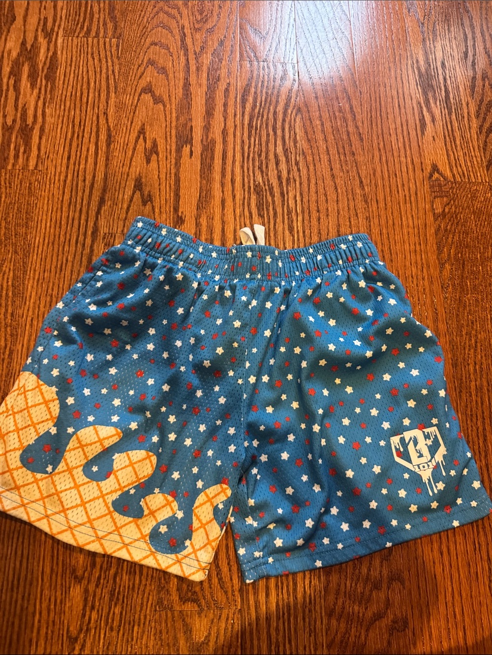 Boys Blue Star-Print Athletic Shorts with Orange Accent